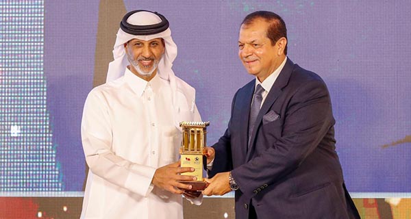 Sheikh Hamad bin Khalifa Al Thani, left, awards Ali Al Buainain in Doha on Tuesday. 